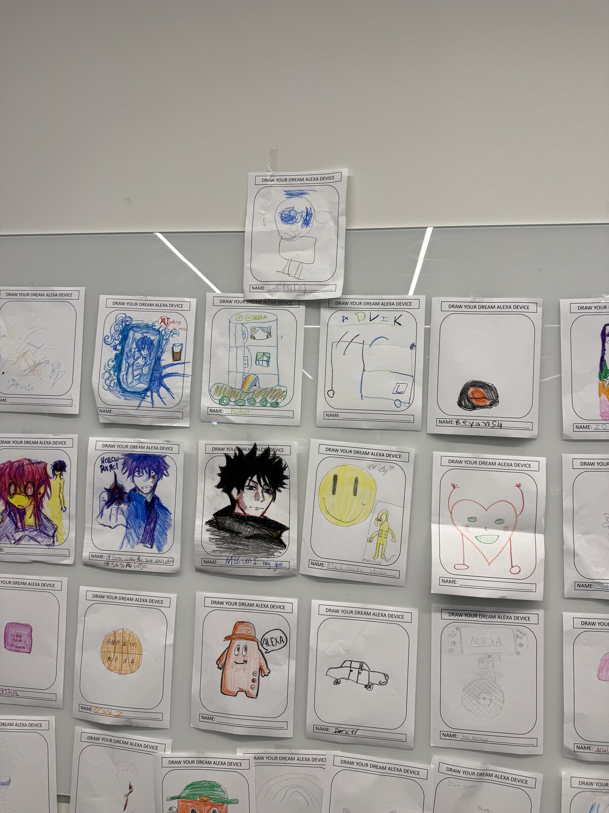 Kids artwork taped to a wall with Jichang's drawing among the pictures