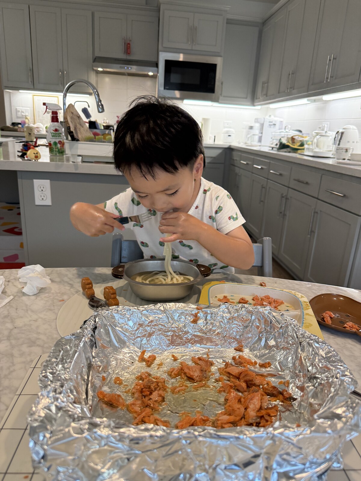 Jichang eating udon noodles at home for dinner