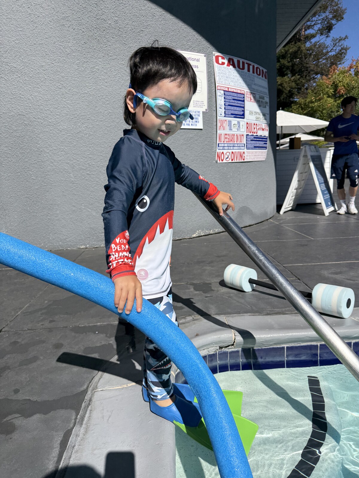 Jichang wearing swim gear and goggles before going to the pool
