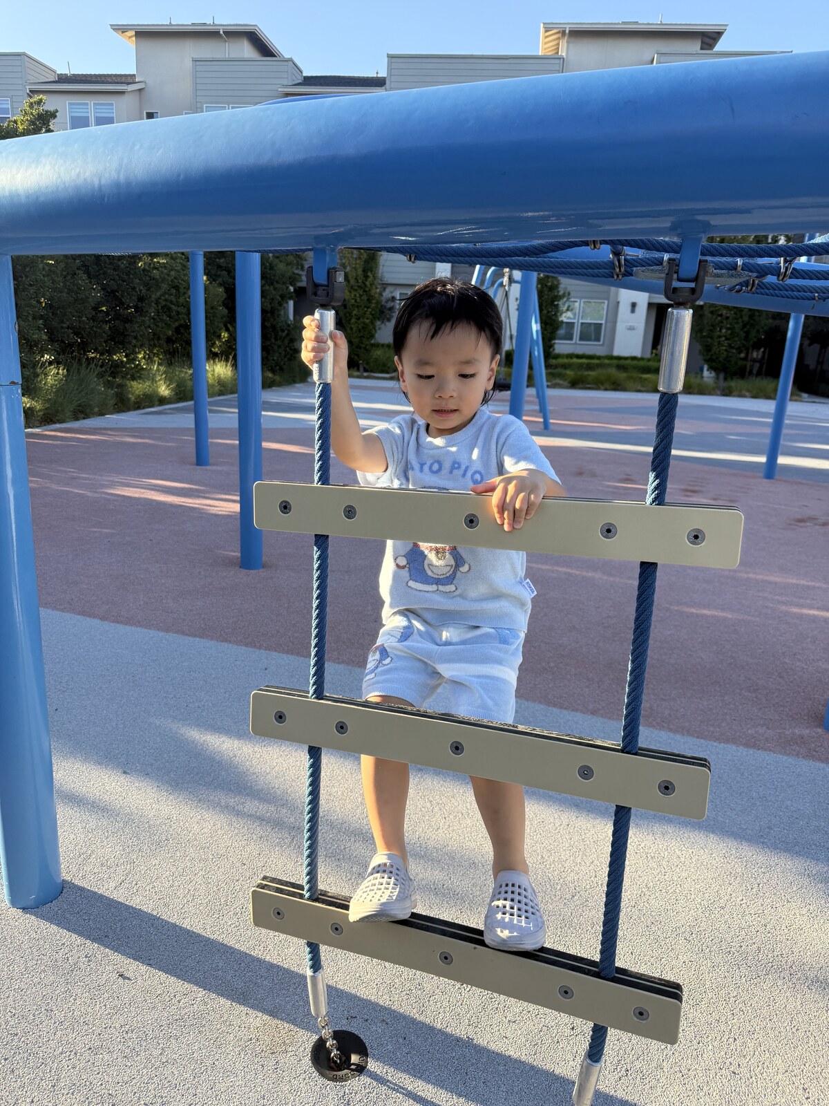 Jichang climbing at the playground before going home