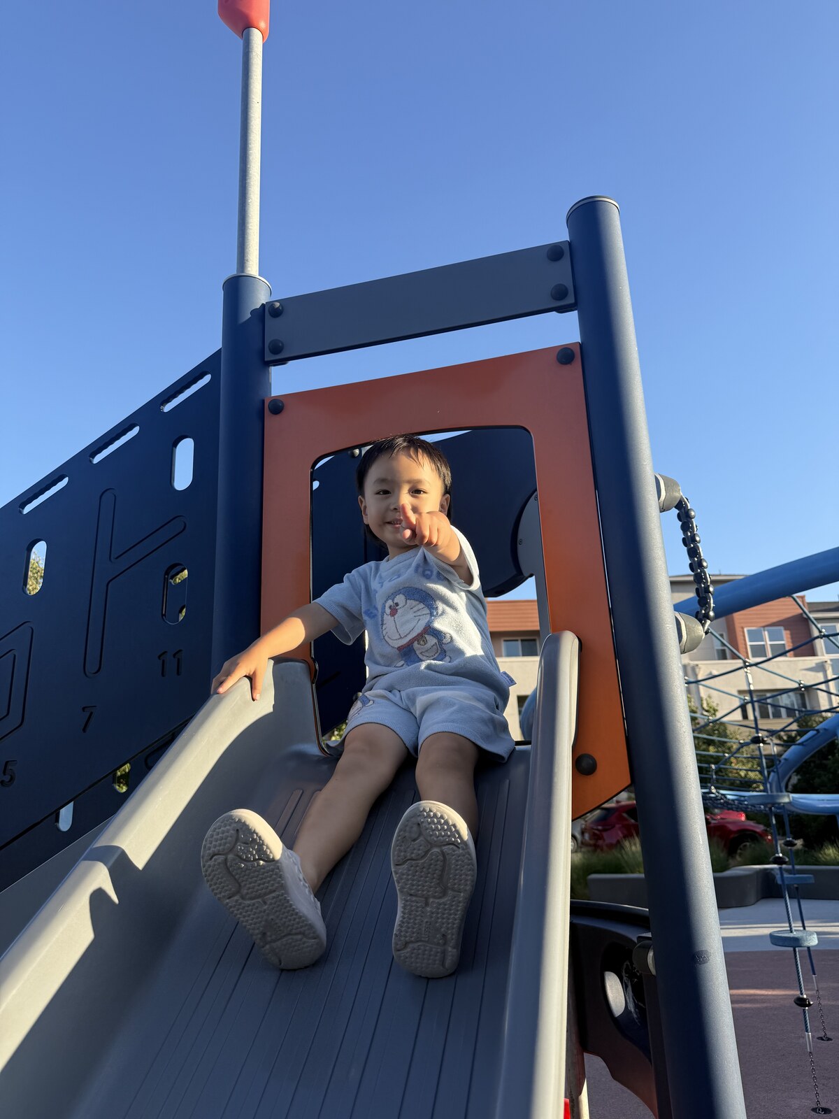 Jichang sliding at the playground before swimming