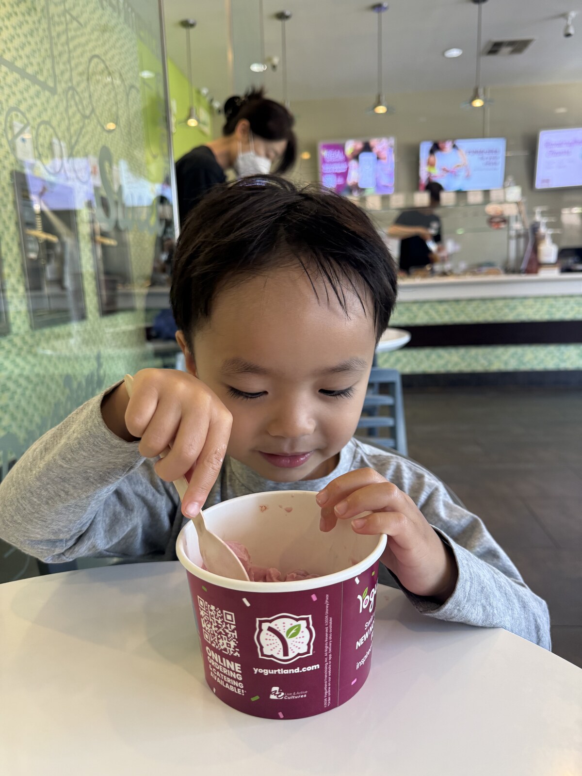 Jichang tasting strawberry frozen yogurt at YogurtLand