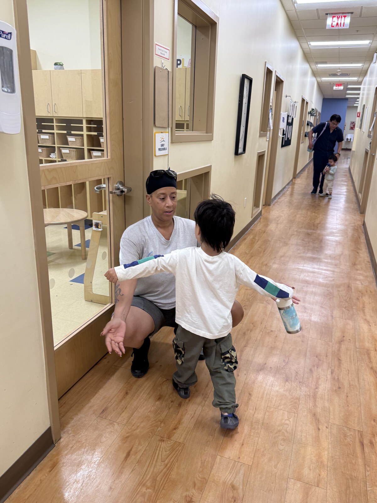 Jichang giving Miss Shafon a big hug in the school hallway