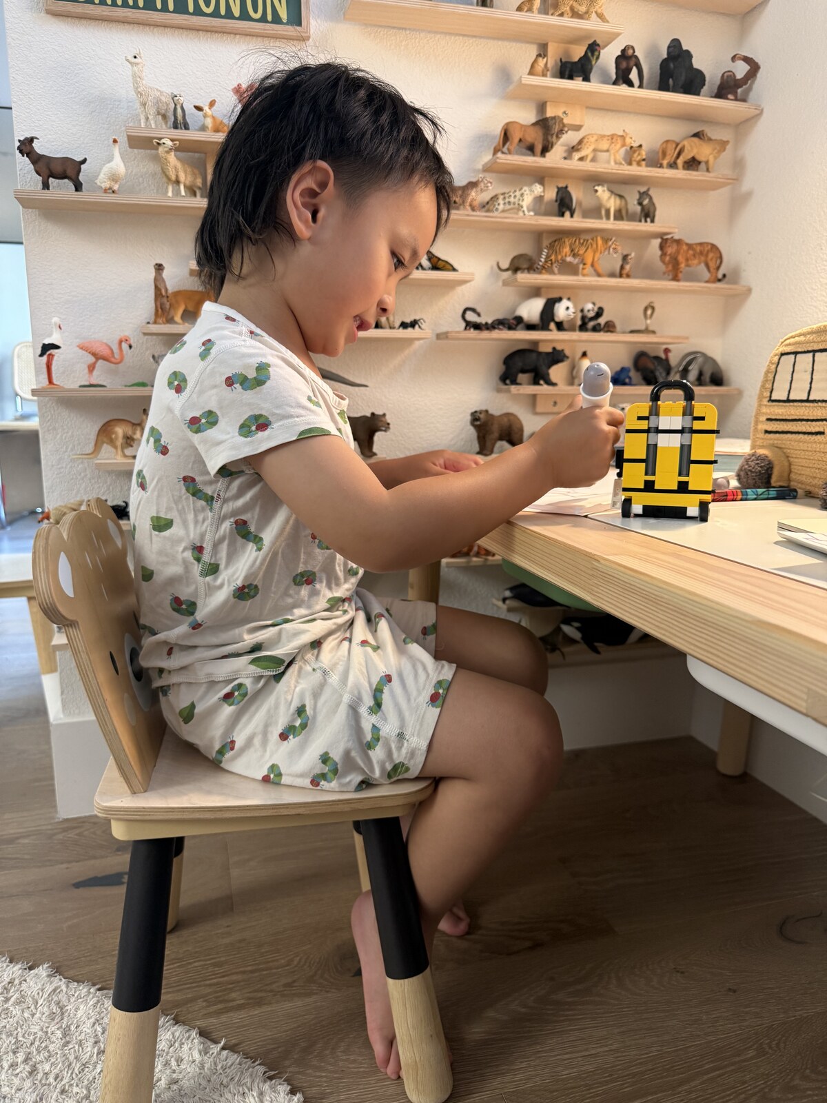 Jichang drawing Number Blocks at his desk