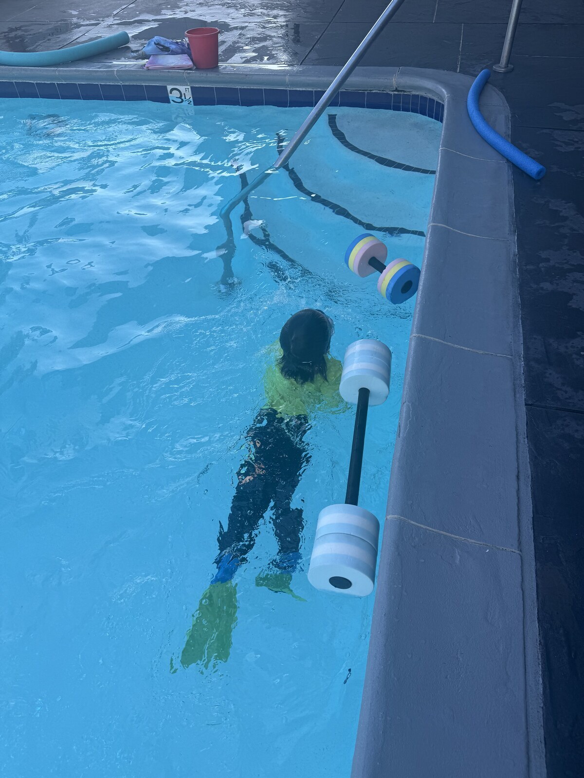Jichang swimming in a pool after dinner
