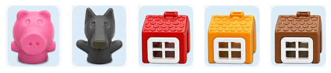 Three toy houses with a pig and a wolf